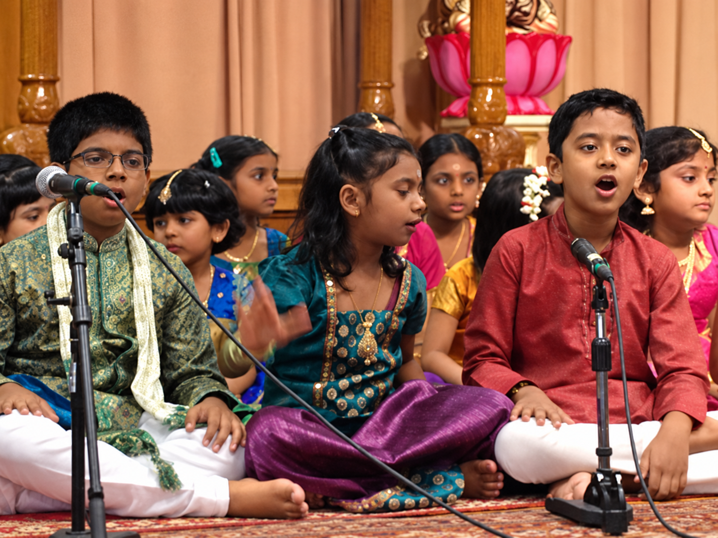 Young Sapthaswaras students singing together at a performance