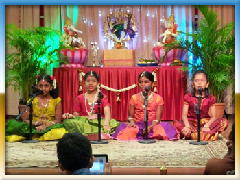 Four students performing Carnatic music